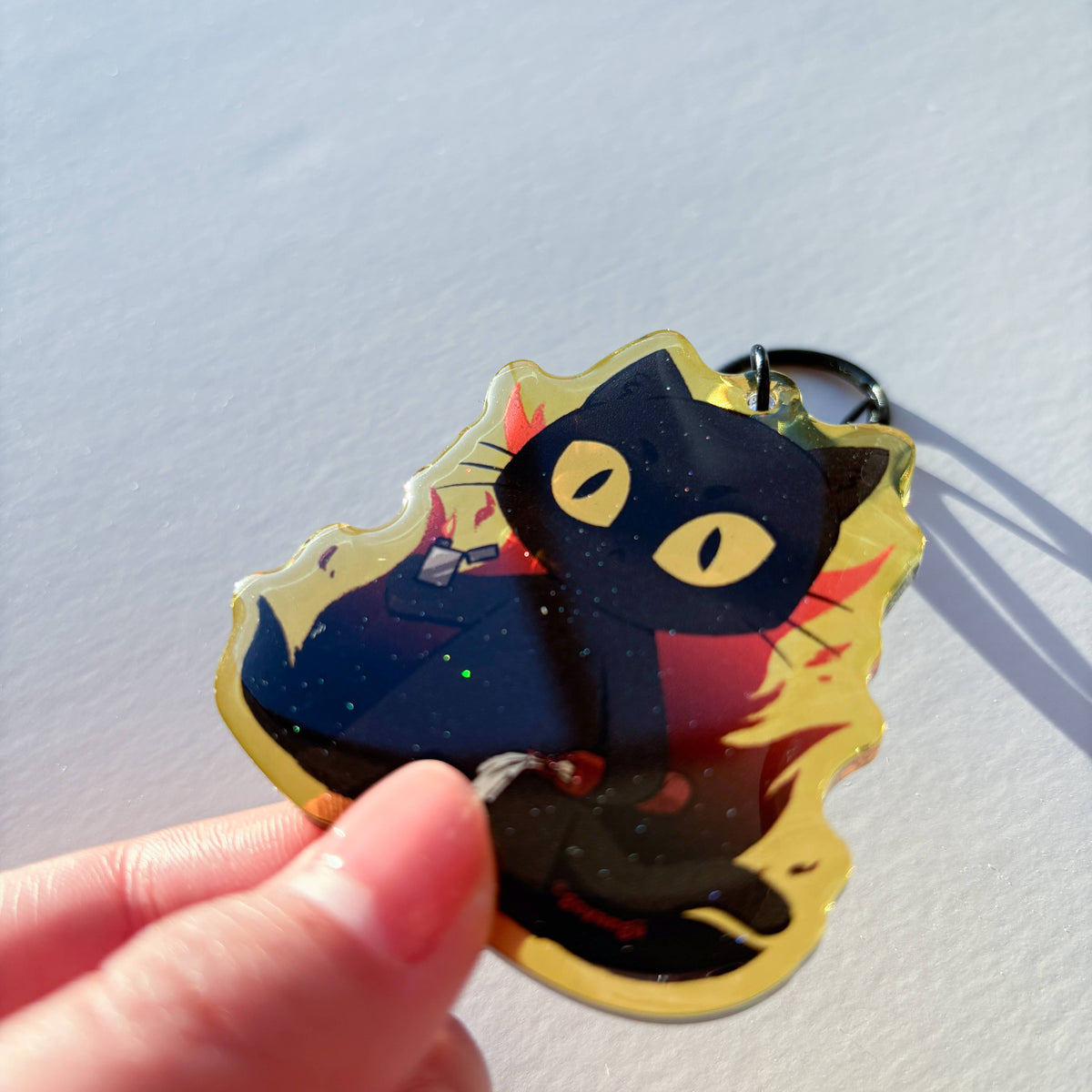 Arson Cat Glitter Acrylic Keychain
