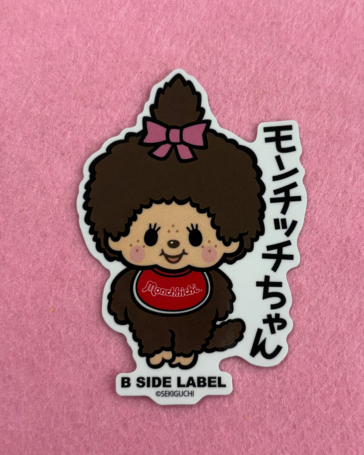 Sticker of a cartoon character with text on a pink background