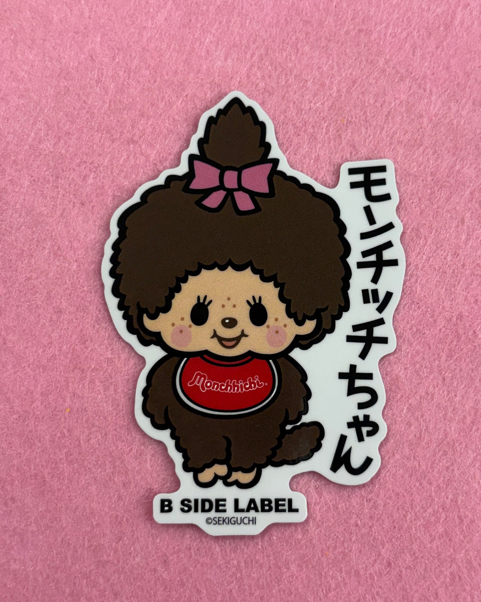 Sticker of a cartoon character with text on a pink background