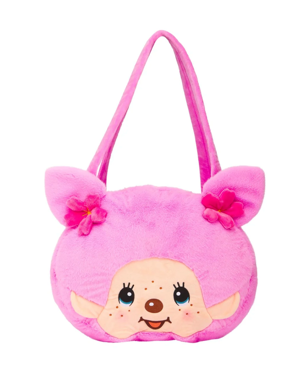 A pink plush shoulder bag shaped like a cartoon character's head, featuring a smiling face, long ears with pink flower accents, and a matching pink shoulder strap, shown on a plain white background.
