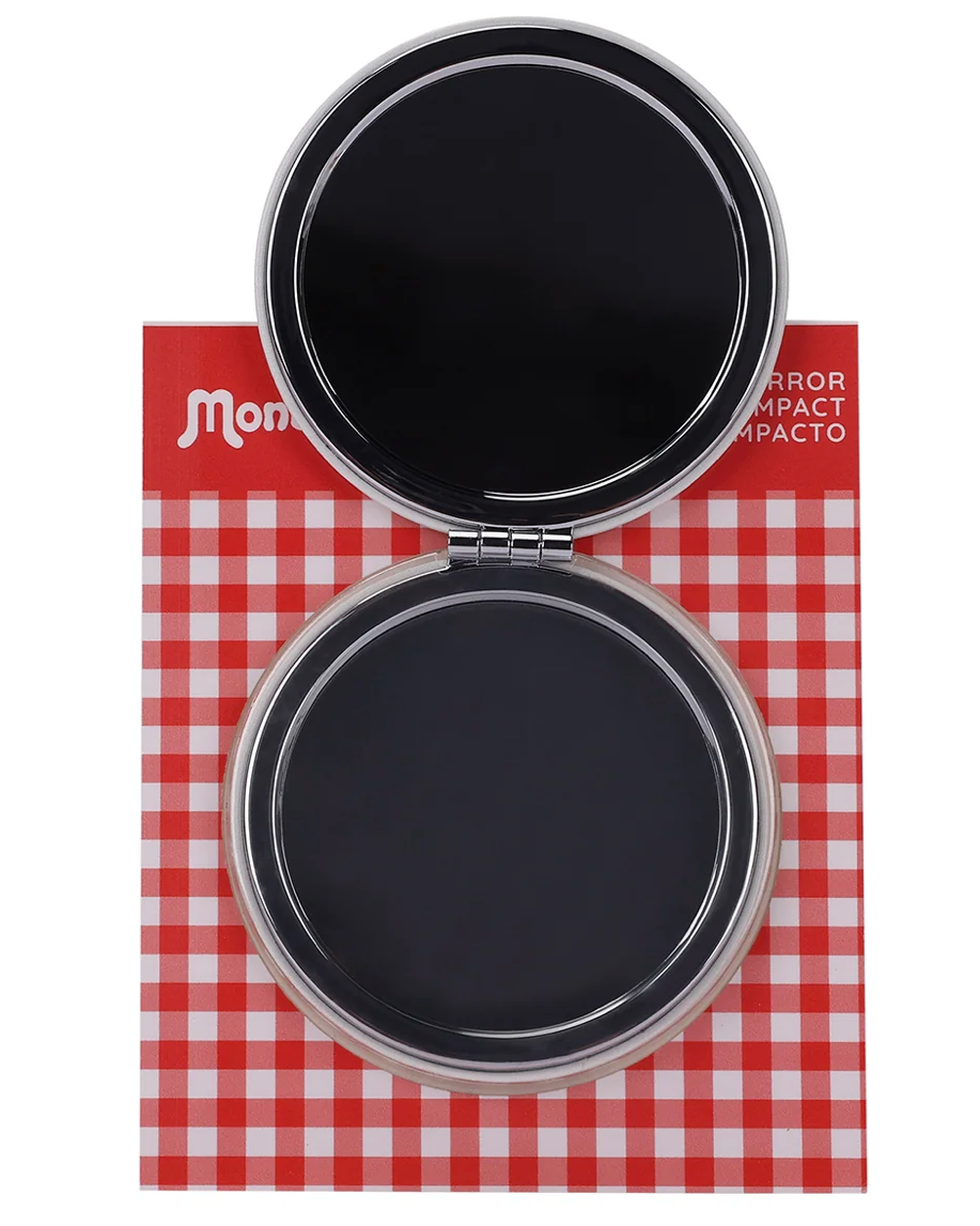 An open round compact mirror with a red and white gingham patterned backing and a red header card. The compact has a clear outer rim and a black interior mirror surface.